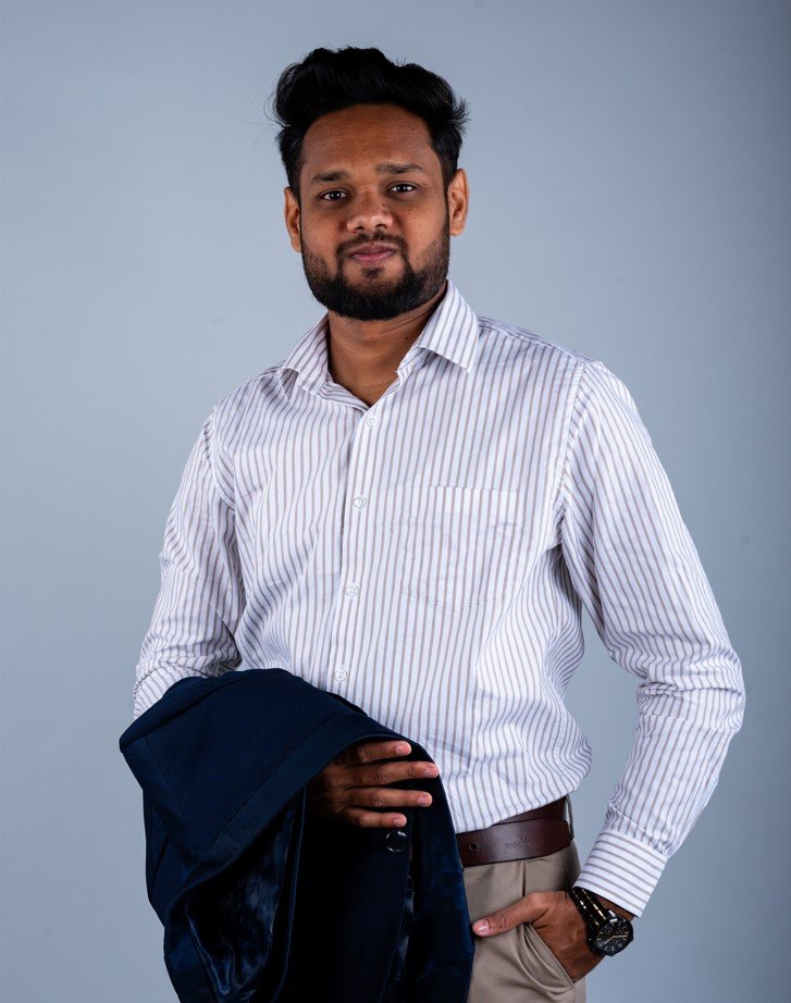 Naman Nandurkar, Founder and CEO of Octmi, in a white shirt portrait in Pune